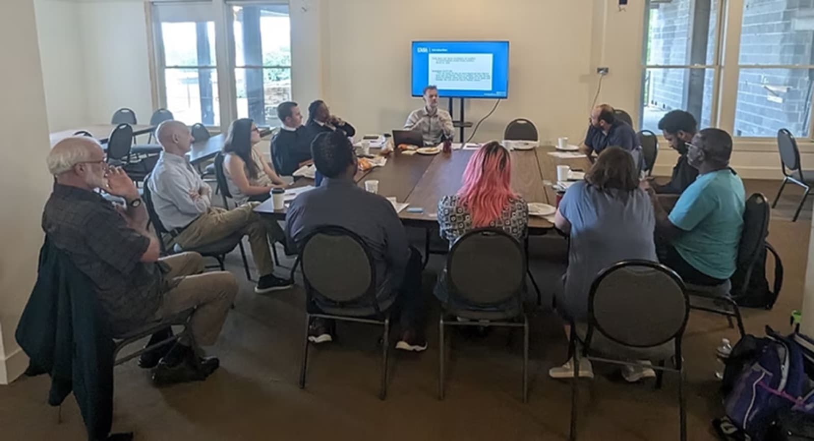 Coalition members gathered around a table at a CJC roundtable meeting