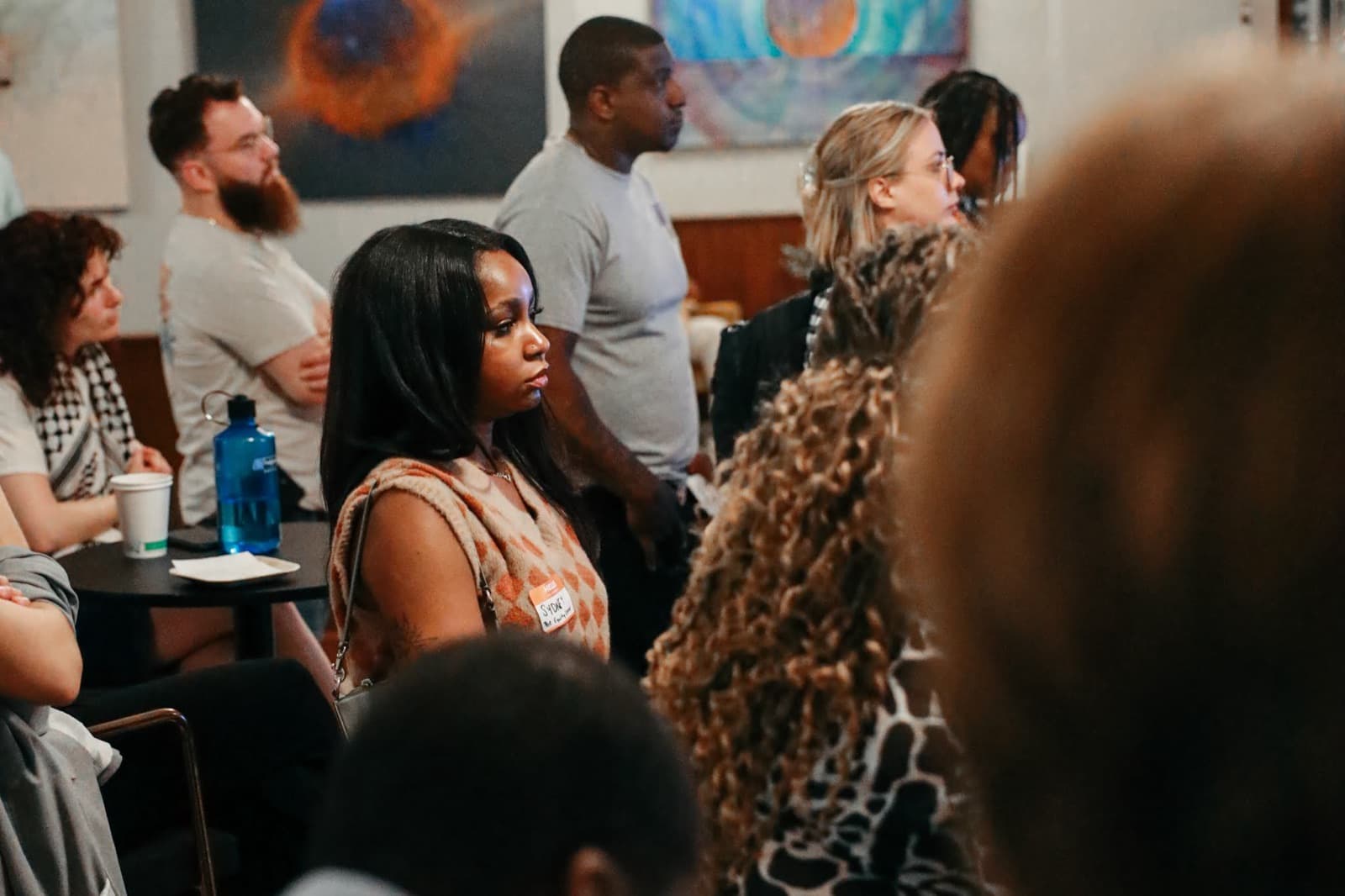 Community members gathered at a CJC event listening during a session